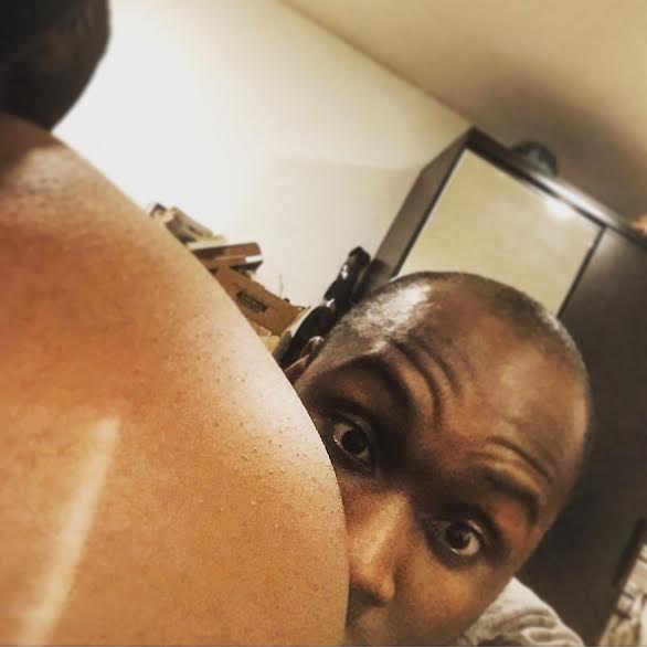 Knock, knock: Anslem hangs out with wife Starrene's belly. 